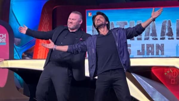 FIFA World Cup 2022 final: Watch Shah Rukh Khan teach Wayne Rooney his iconic pose as he promotes Pathaan