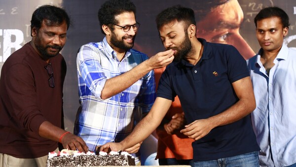 Team cuts a cake to celebrate the success