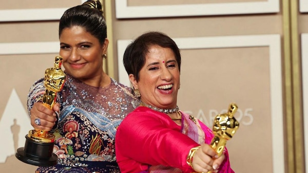 Kartiki Gonsalves and Guneet Monga at the 95th Academy Awards
