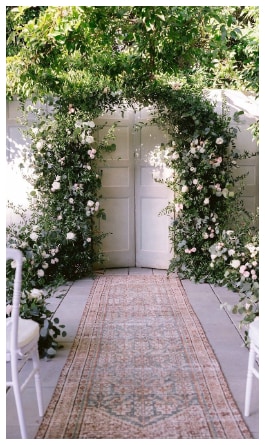 The handmade wedding ceremony floral arch