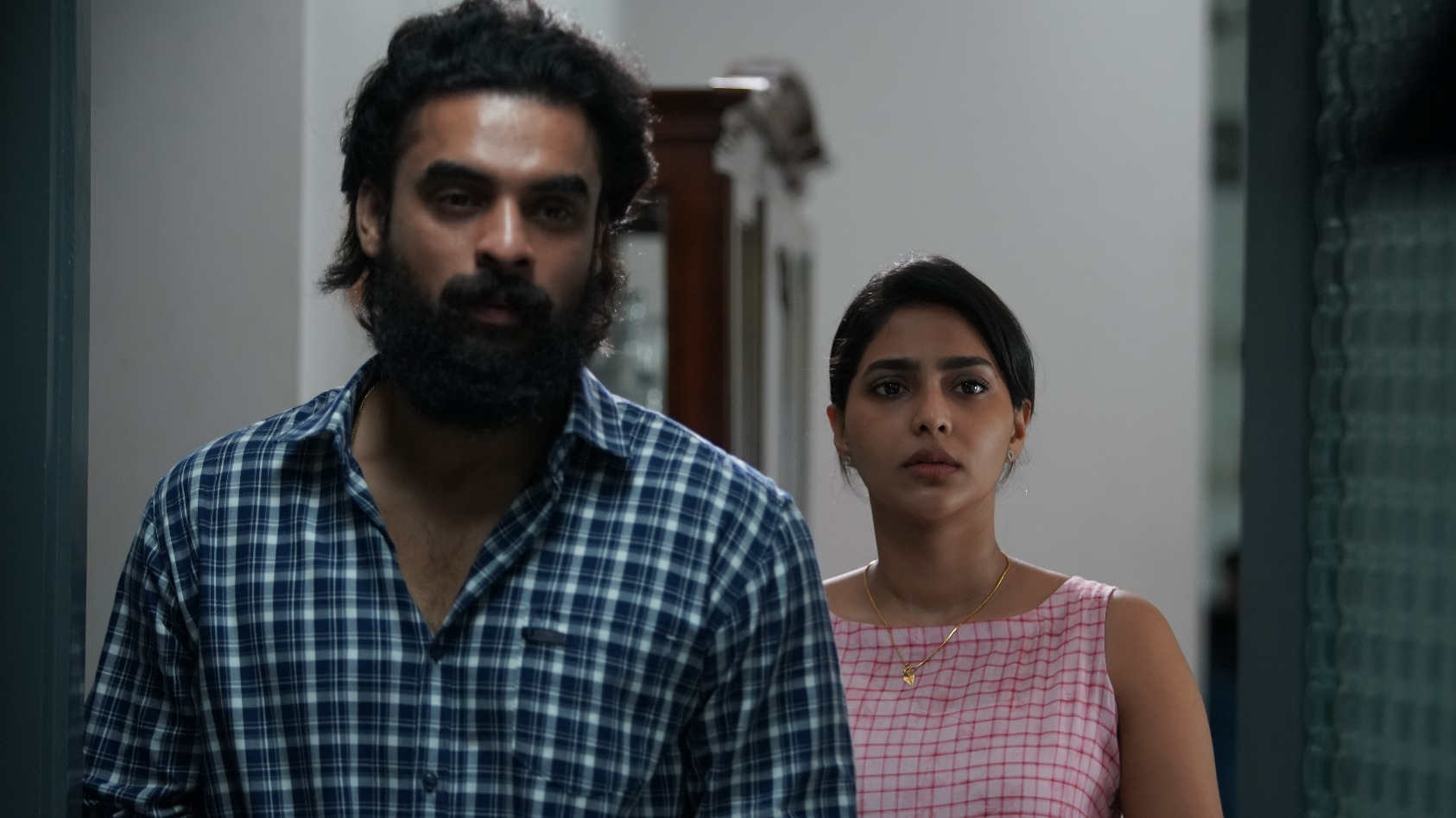 Tovino Thomas and Aishwarya Lekshmi in a still from Kaanekkaane