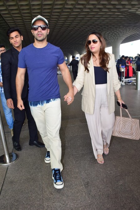 Varun Dhawan protects wife Natasha Dalal as they get spotted at Mumbai ...