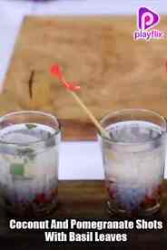 Coconut And Pomegranate Shots With Basil Leaves