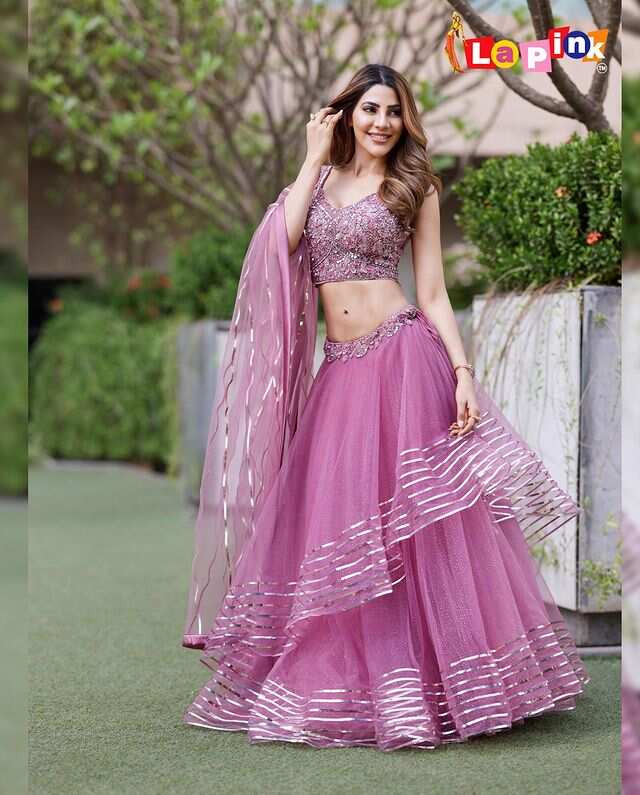 nikki tamboli yellow lehenga