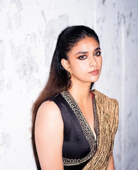 Keerthy Suresh looks ethereal dressed in a black and gold ensemble