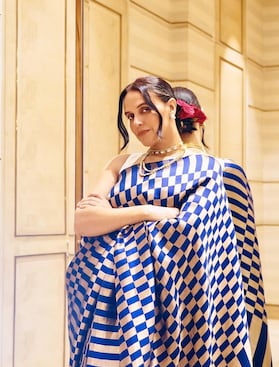 Neha Dhupia looks gorgeous styled in a blue saree