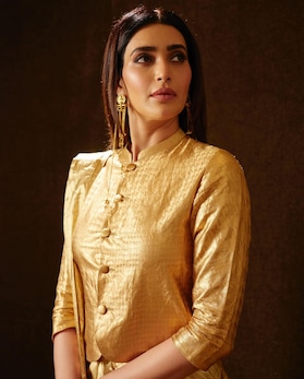 Dont miss Karishma Tannas style statement in a metallic saree