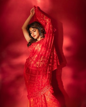 Iswarya Menon sets hearts racing in a red embroidered saree
