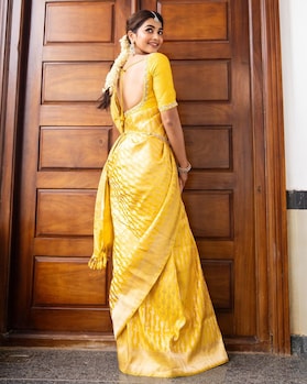 Pooja Hegde embodies Indian royalty in vibrant yellow saree
