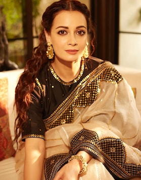 Dia Mirza exudes elegance in a beige and black saree